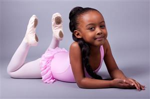 Young ballet dancer on her belly