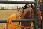 Teen Girl Tending a Horse